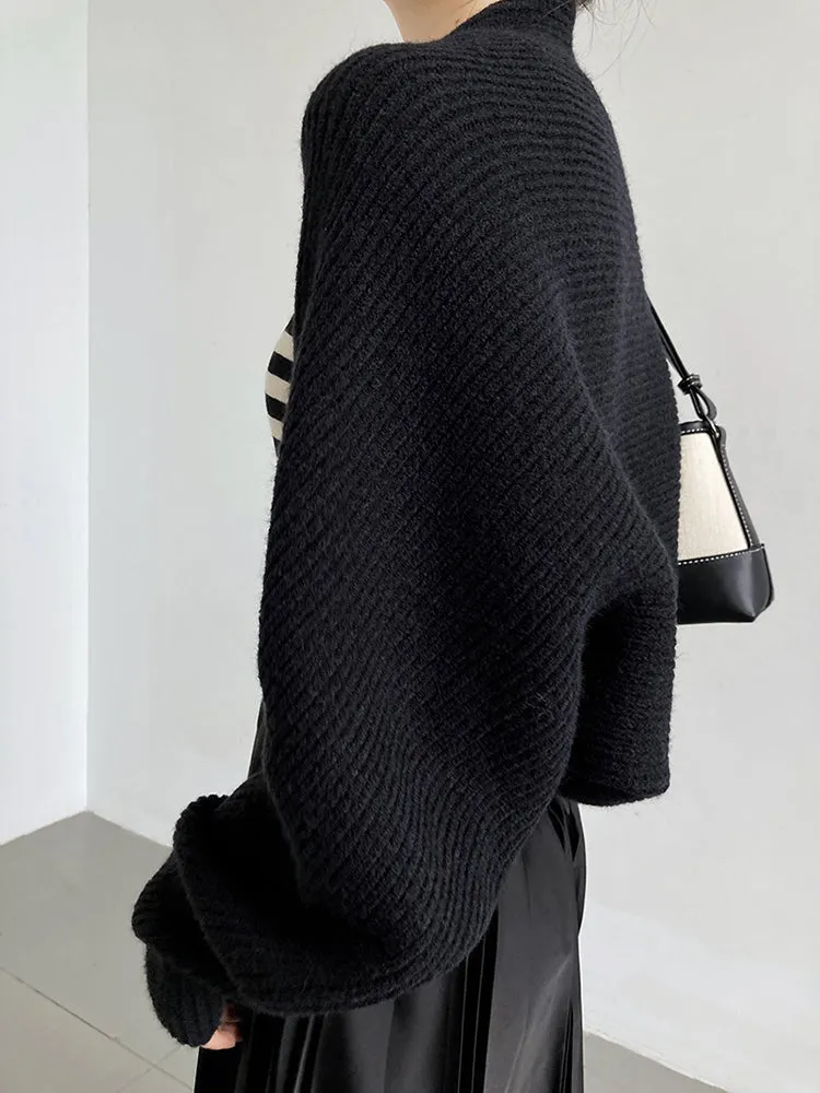 Elegance Wrapped: Black Knitted Shrug Scarf